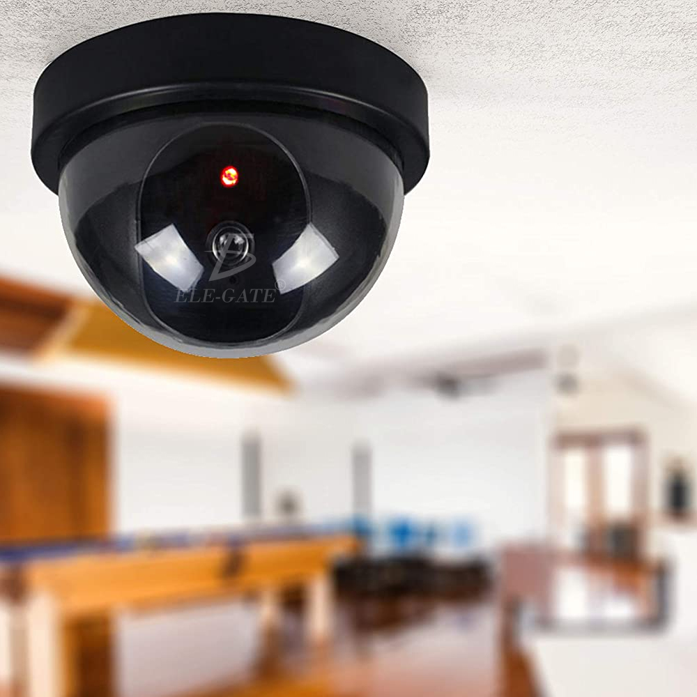 Cámara de seguridad falsa, sistema de vigilancia de bala CCTV falsa,  aspecto realista, impermeable, con una luz LED roja intermitente y  calcomanía de